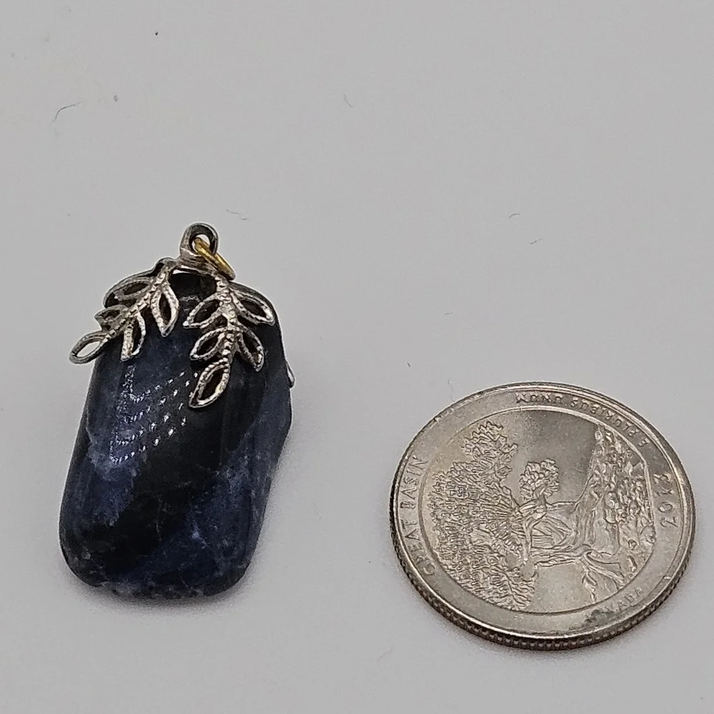 sodalite blue stone pendant with silver tone leafy bail